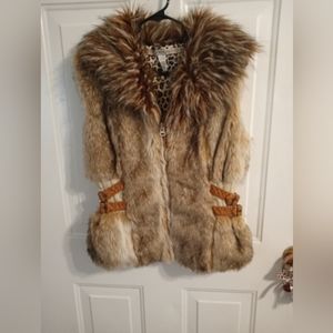 Women's size large faux fur with leather zip up vest